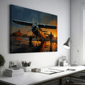 Framed canvas print of a vintage biplane at sunset with pilot walking and the aircraft's reflection on the wet ground