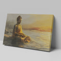 Wall canvas print of a meditative Buddha statue in golden and orange hues reflecting on tranquil waters at sunrise.