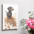 Framed canvas print of a realistic Dachshund standing amidst autumn leaves in warm brown and amber tones