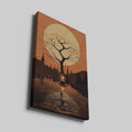 Framed canvas print of a silhouetted tree and candle with golden autumnal hues