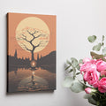 Framed canvas print of a silhouetted tree and candle with golden autumnal hues