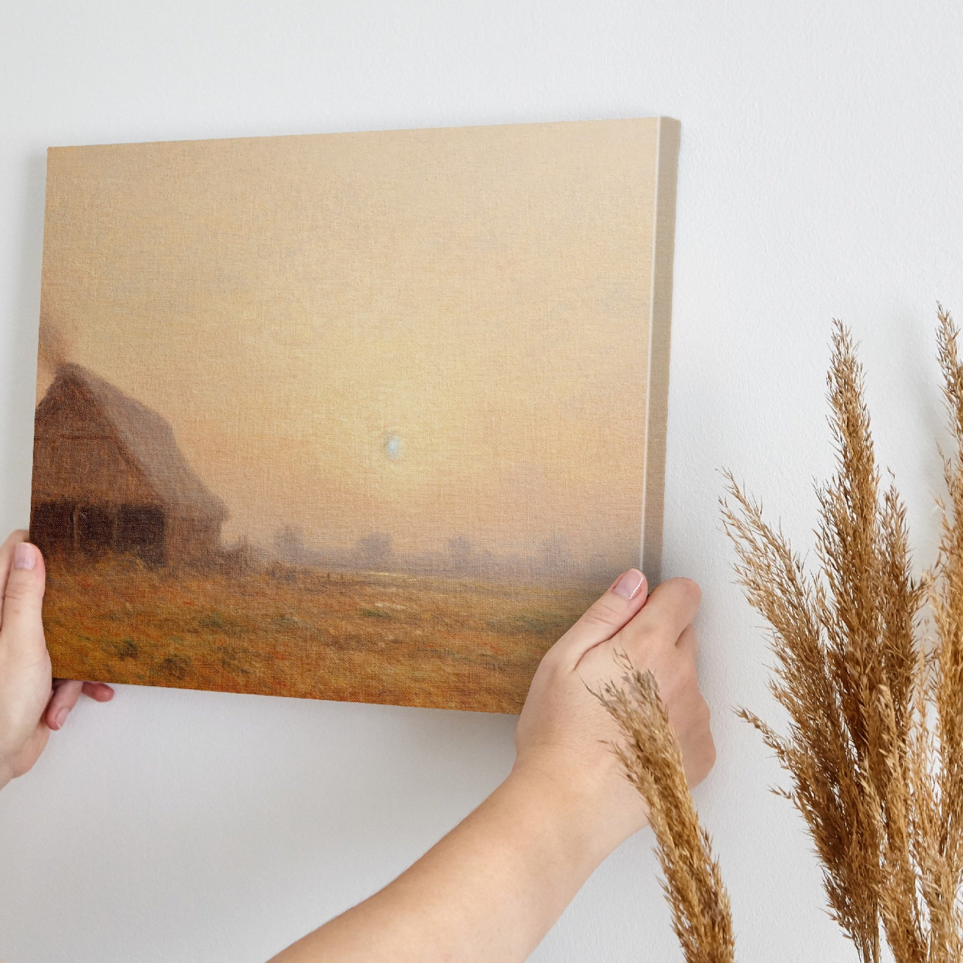 Framed canvas print of golden sunrise with a thatched cottage in a tranquil countryside scene