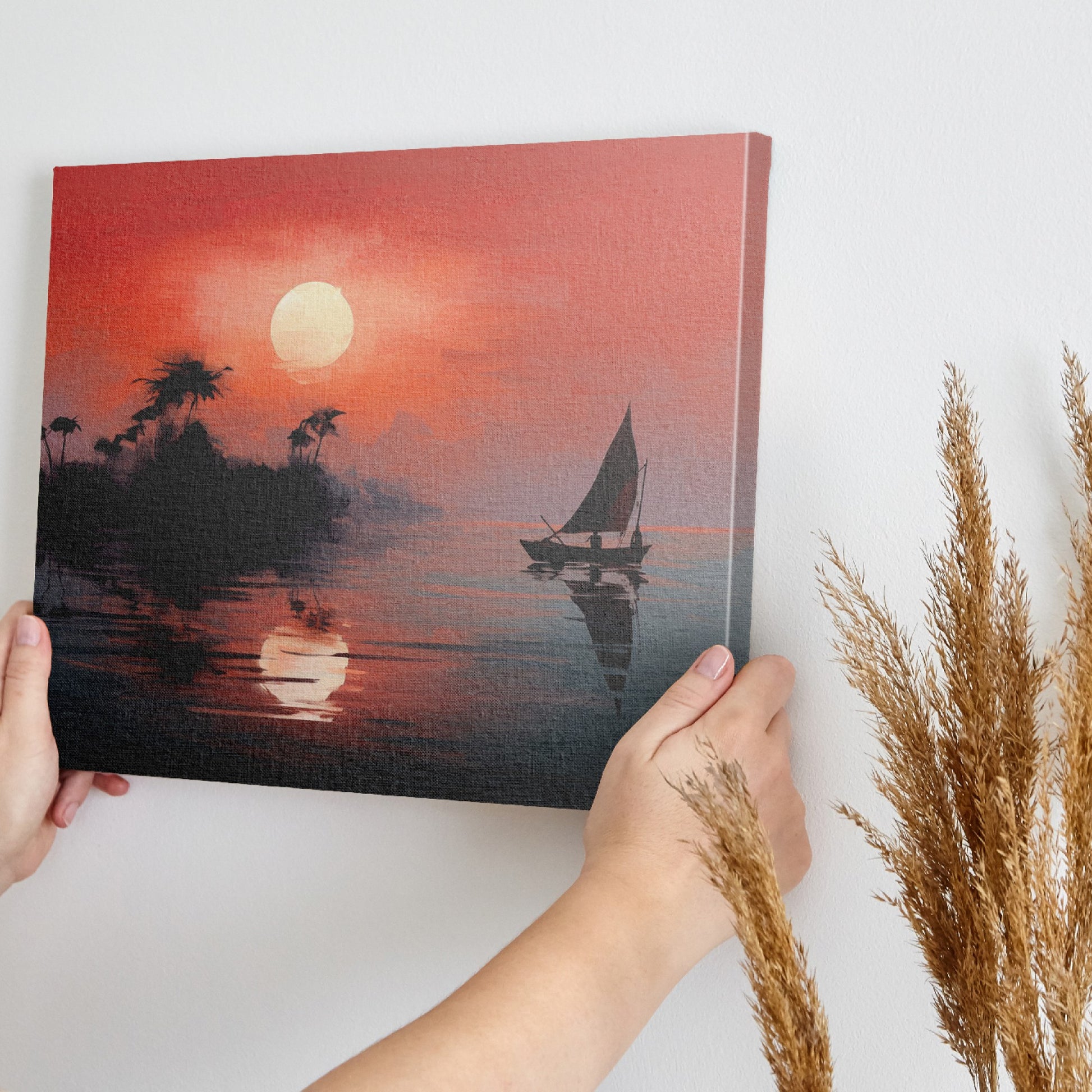 Framed canvas print of a tropical sunset with silhouette of sailboat and palm trees reflection on the water