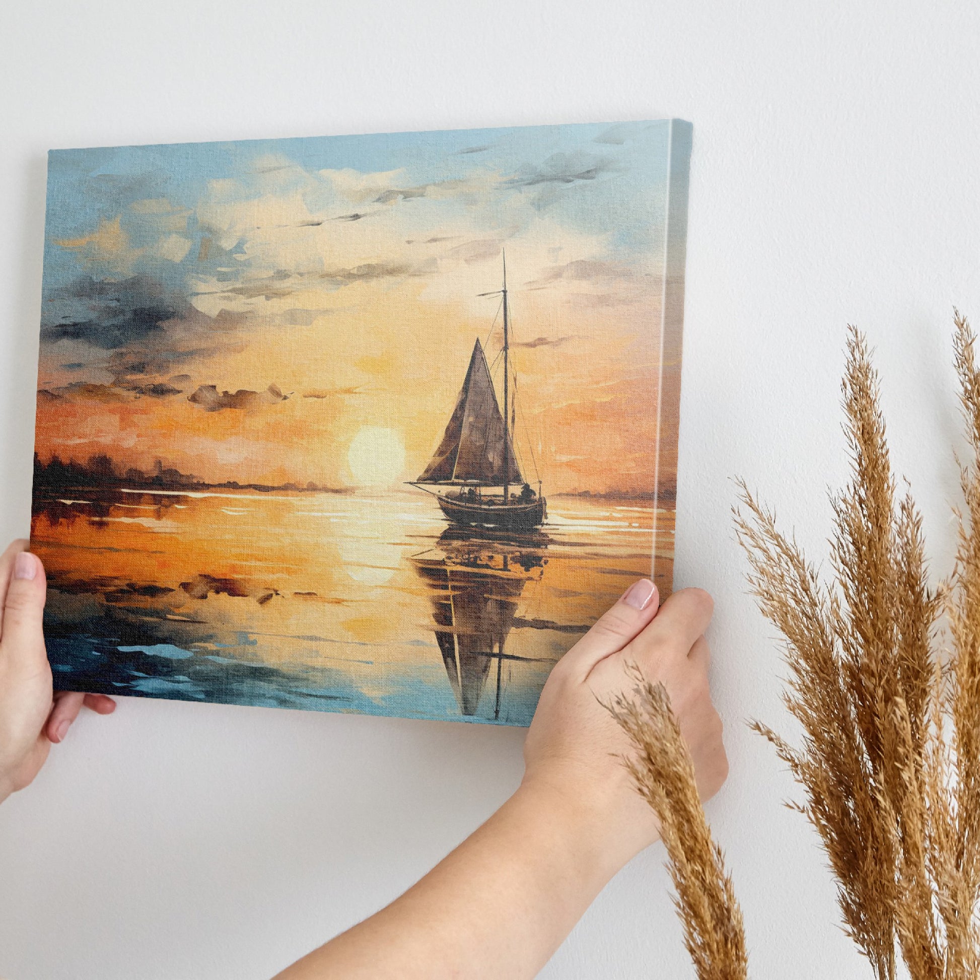 Framed canvas print of sailboat against golden sunset with peaceful ocean reflection