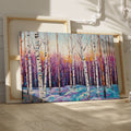 Framed canvas print of a vibrant geometric mosaic depicting an abstract birch forest with coloured leaves and sunset backdrop