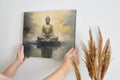 Framed canvas print of a serene Buddha in meditation with abstract golden backgrounds