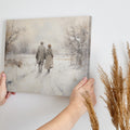 Framed canvas print of a couple walking hand-in-hand through a tranquil snowy landscape with warm earthy tones and soft whites.