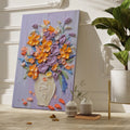 Framed canvas print of vibrant impasto-style floral bouquet with textured vase