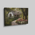 Framed canvas print of a picturesque cottage surrounded by blooming garden and shaded by trees