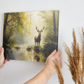 Impressionist painting of a stag by a water body amidst a yellow and brown autumn forest.