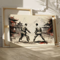 Framed canvas print depicting two karate practitioners in a traditional dojo with red accents