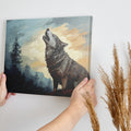 Framed canvas print of a howling wolf in a forest at dusk with vibrant earthy tones