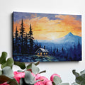 Framed canvas print of a mountain sunrise with a rustic cabin amongst pine trees