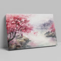 Framed canvas print of a watercolour cherry blossom landscape with figures and traditional architecture