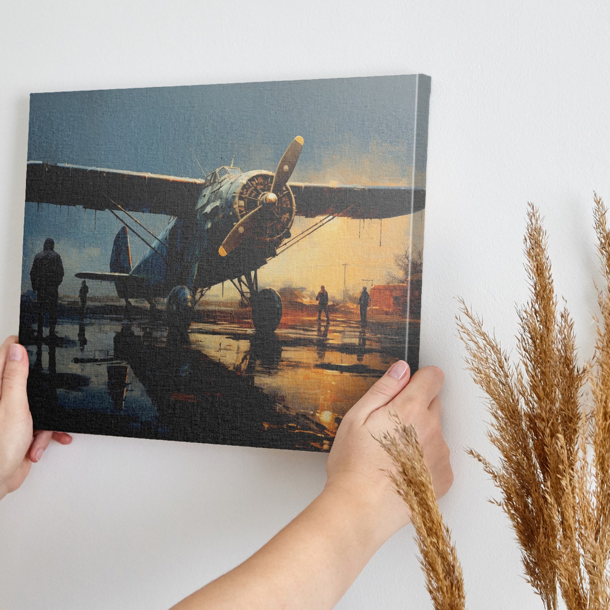 Framed canvas print of vintage warplane at a reflective wet airfield during twilight