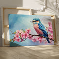 Framed canvas print of a colourful bird on a blossoming cherry branch