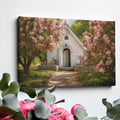 Framed canvas print of a chapel surrounded by lush pink blossom trees