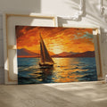 Framed canvas print of a sailboat against a vivid sunset with warm orange and blue tones