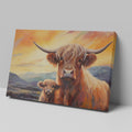 Framed canvas print of Highland cattle with calf at sunset, warm tones and mountain backdrop