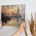 Framed canvas print of London's Big Ben and River Thames at sunset with warm orange hues