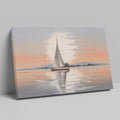 Framed canvas print of a sailboat at sunset with reflections on tranquil waters