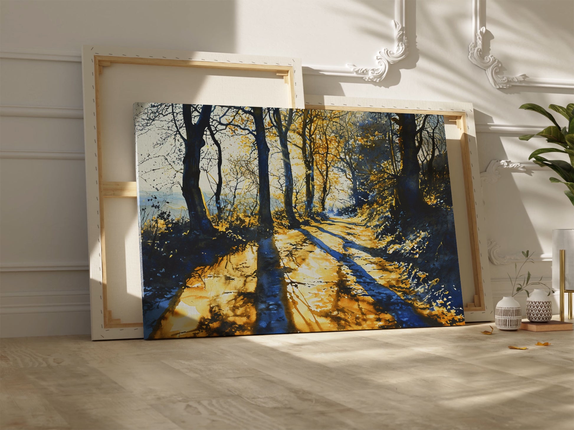 Framed canvas print of a sunlit forest pathway with golden tones and tree silhouettes