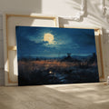 Framed canvas print of a moonlit rustic meadow with a full moon, golden tones and blue hues