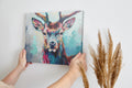 Framed canvas print of a colourful abstract stag with vivid brushstrokes