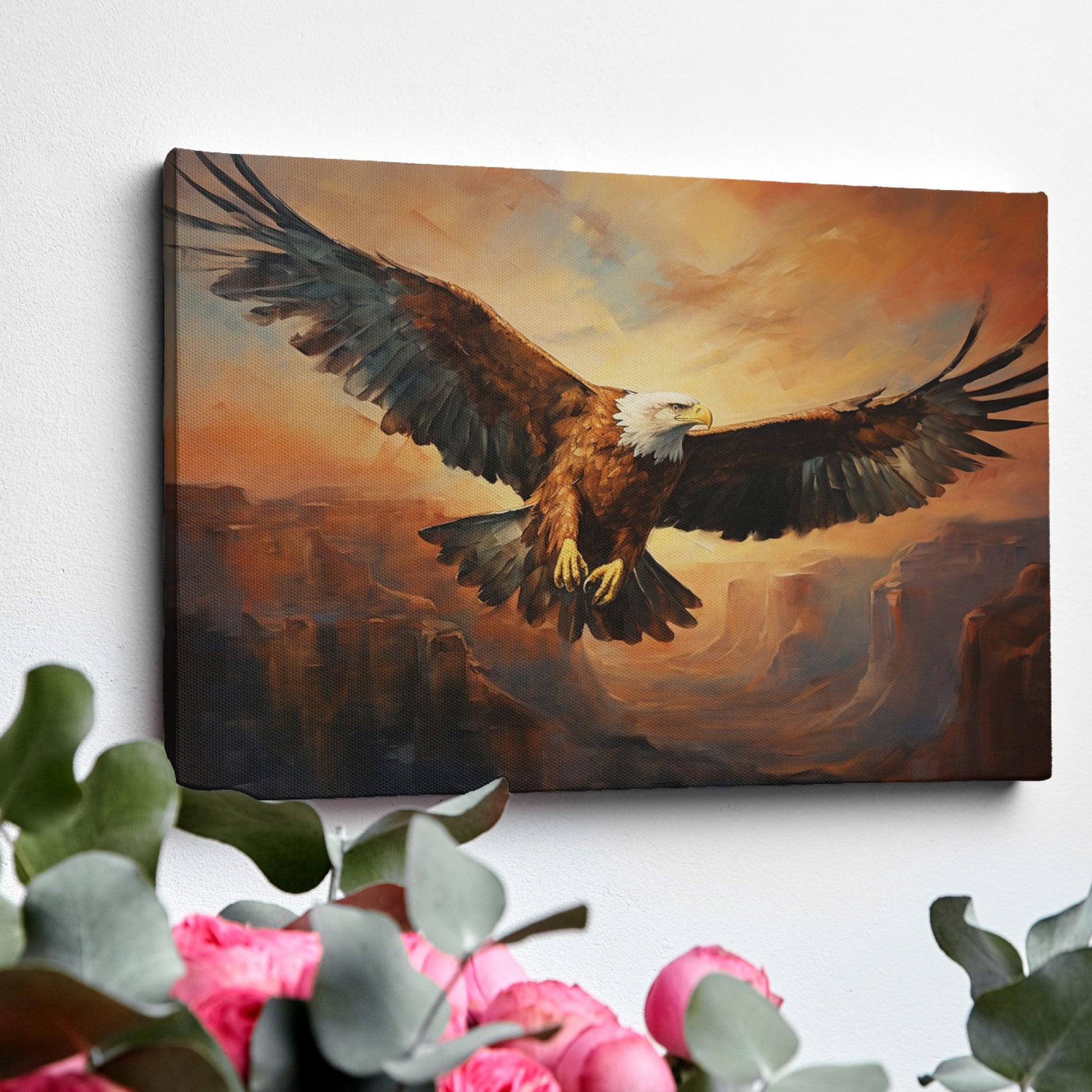 Framed canvas print of a majestic eagle flying over a canyon at sunset with warm golden and orange tones