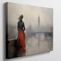 Framed canvas print of an elegant woman overlooking a misty cityscape with a red dress as a focal point