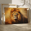 Framed canvas print of a majestic lion portrait with a warm golden colour scheme