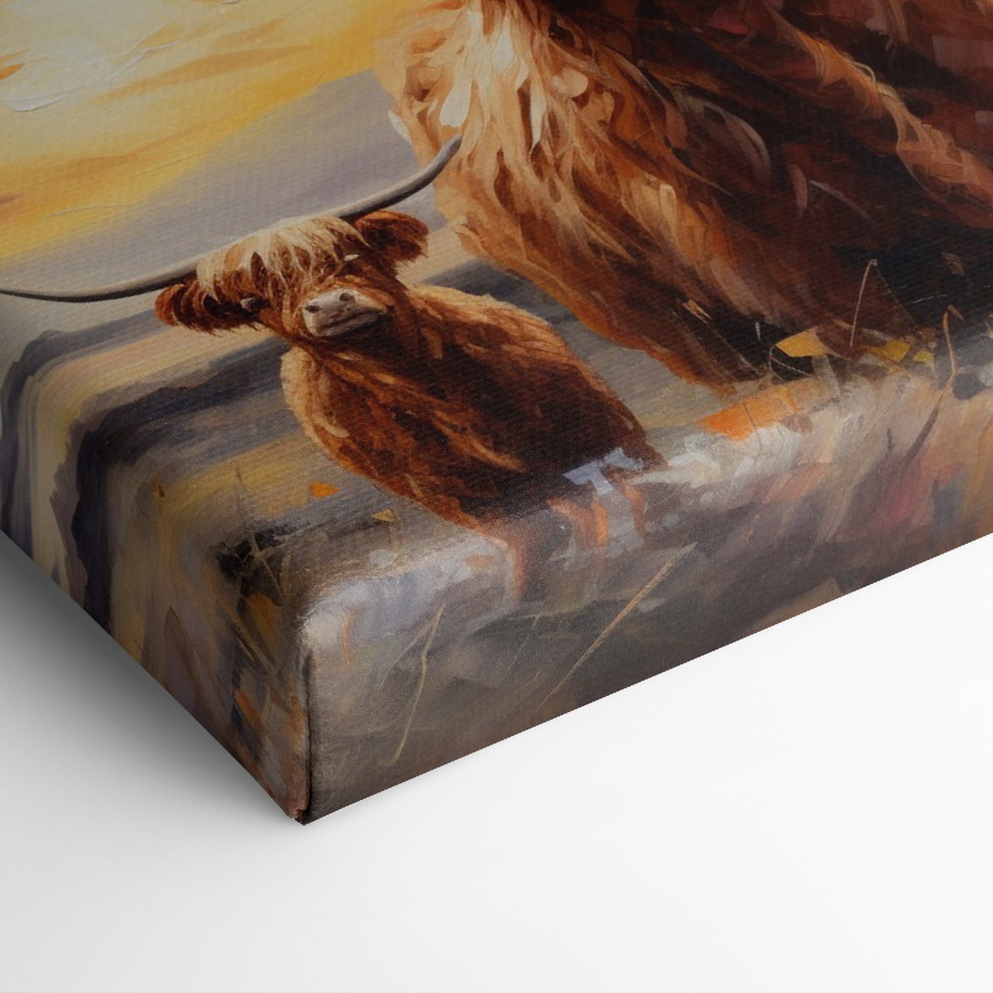 Framed canvas print of a Highland Cow and Calf against a vivid sunset landscape