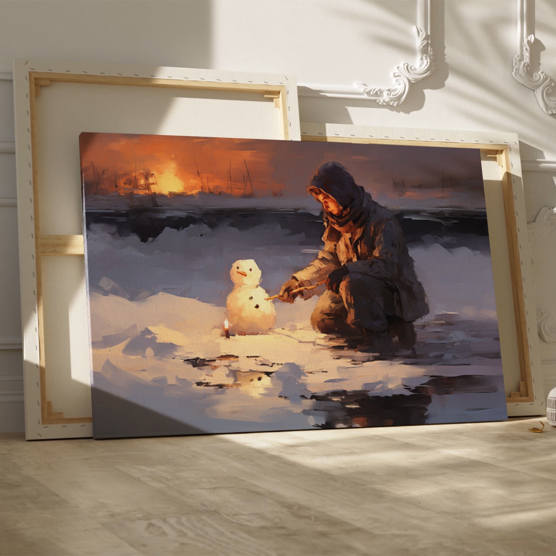 Framed canvas print of a person building a snowman at sunset with a winter landscape