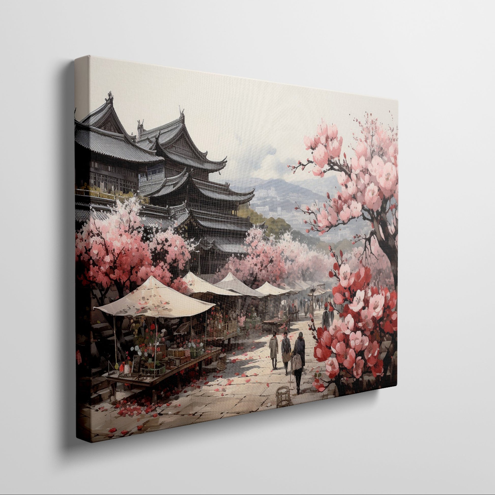 Framed canvas print of a traditional Japanese town during cherry blossom season with pink florals and historic architecture