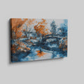 Framed canvas print of an Oriental garden scene with a bridge over water in autumnal hues of orange and blue