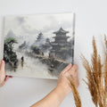 Framed canvas print of a mist-covered ancient Chinese scene with pagodas and figures