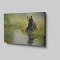 Framed canvas print of a bear sitting by a pond with floral surroundings