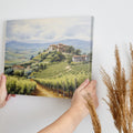 Framed canvas print of a tranquil Tuscan vineyard with rolling hills and Italian country houses