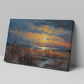 Framed canvas print of an impressionistic sunset over a coastal landscape with vibrant warm hues