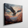 Framed canvas print of a majestic eagle soaring over a canyon at sunset