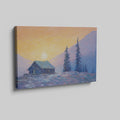 Framed canvas print of an impressionist painting with a mountain cabin at sunset