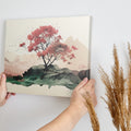 Framed canvas print of a serene cherry blossom tree amidst a minimalist mountain range