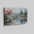 Framed canvas print of a traditional Asian pagoda by a lake with autumn cherry blossoms