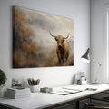 Framed canvas print of a Highland cow in a misty autumnal landscape with warm earthy tones