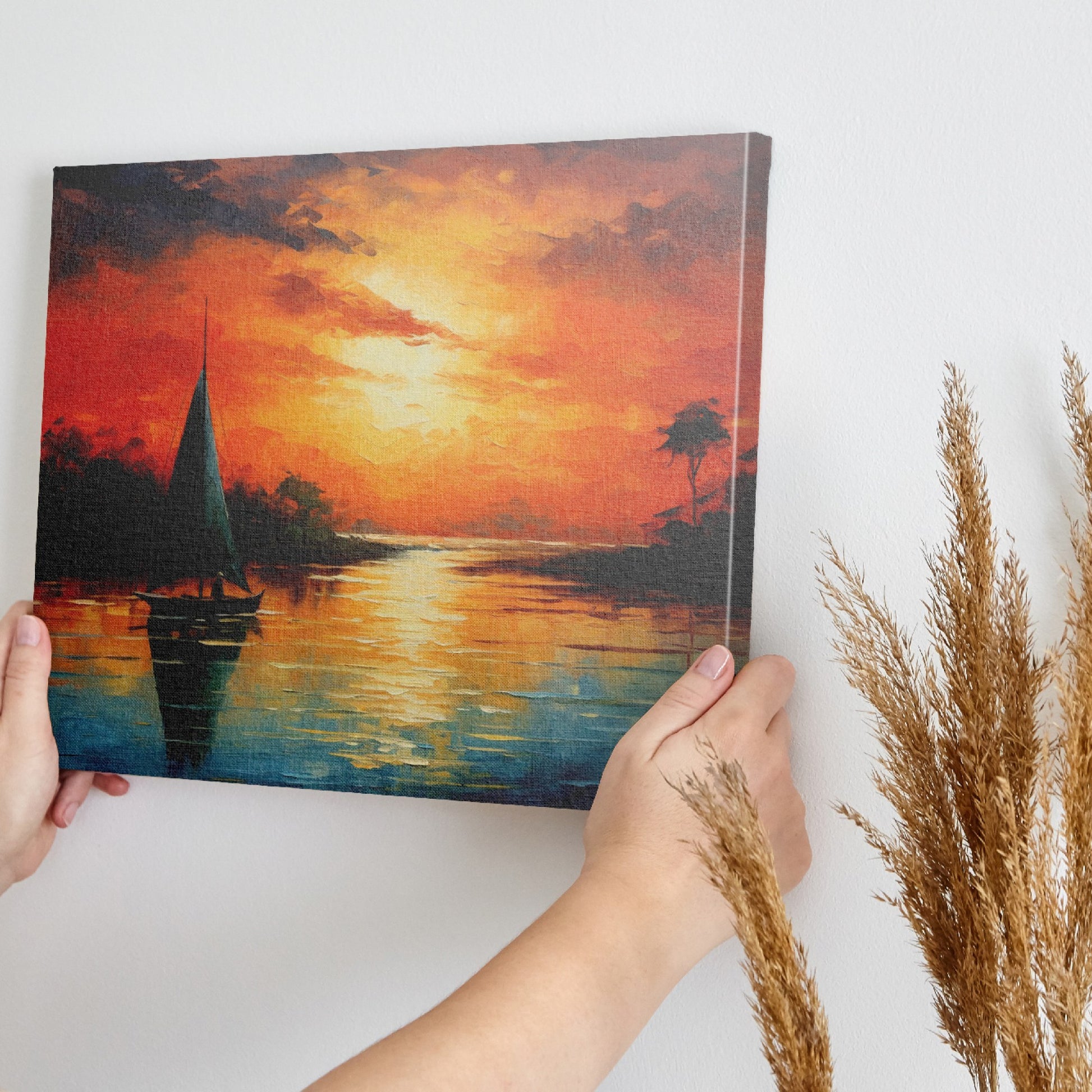 Framed canvas print of a vibrant impressionist sailboat against an orange hued sunset