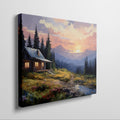 Framed canvas print of a rustic cabin at sunset with a mountainous backdrop