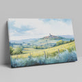 Framed canvas print of a Tuscan landscape with watercolor rolling hills and a village