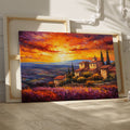 Framed canvas print of an Impressionist Tuscan landscape with a vibrant sunset sky, overlooking lavender fields and rustic houses.