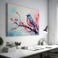 Framed canvas print of a vibrant bluebird on cherry blossom branch in watercolor