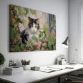 Framed canvas print of impressionist painting featuring a cat with roses and green leaves